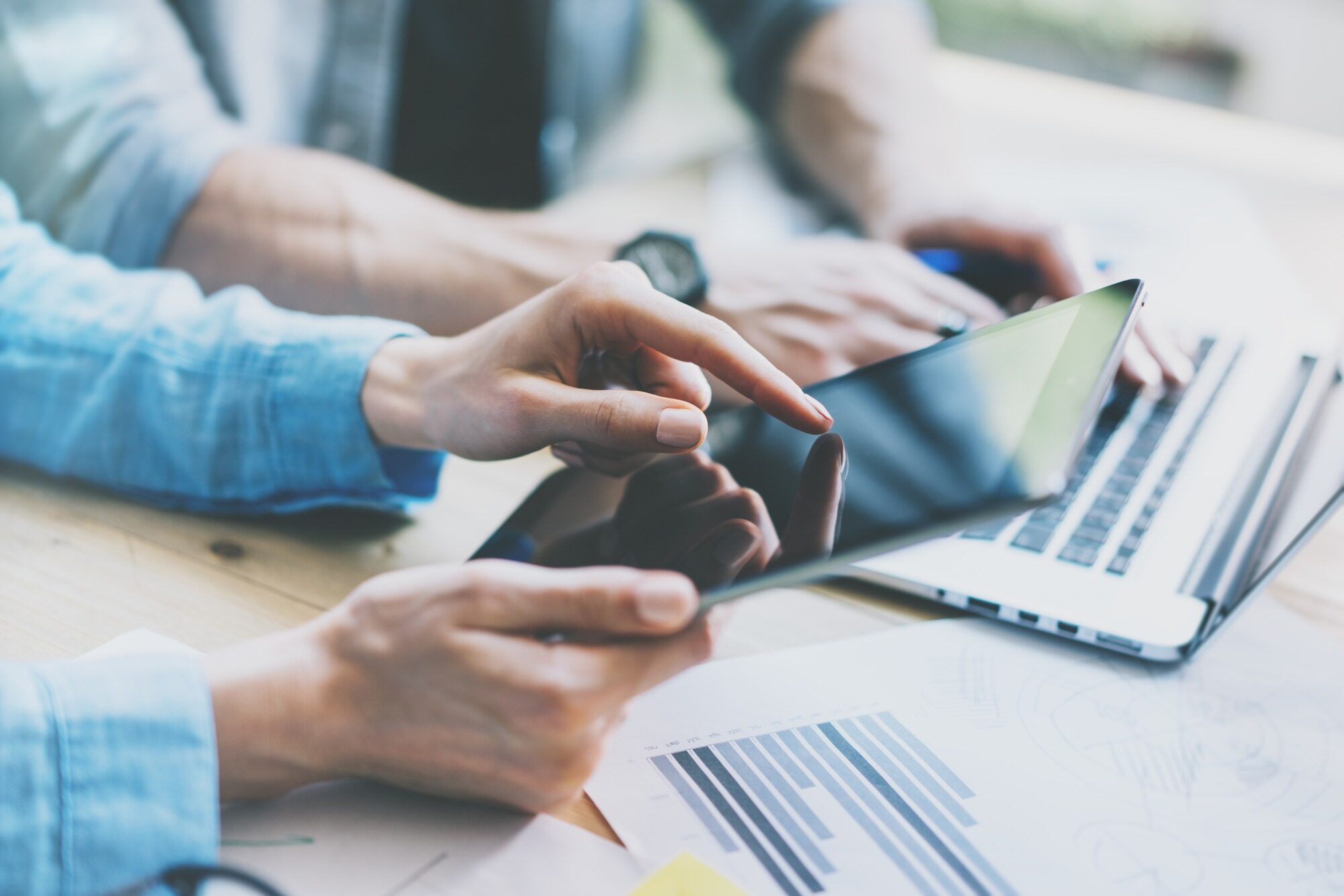 Coworkers Team Work Process in Modern Office Studio.Project Department Using Hand Digital Tablet.Reflections Screen.Young Business Crew Working with New Startup Studio. Blurred,film effect.