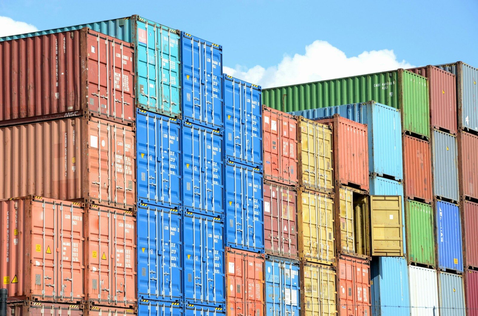 blue red and yellow intermodal shipping containers